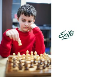 Boy playing chess, selective focus